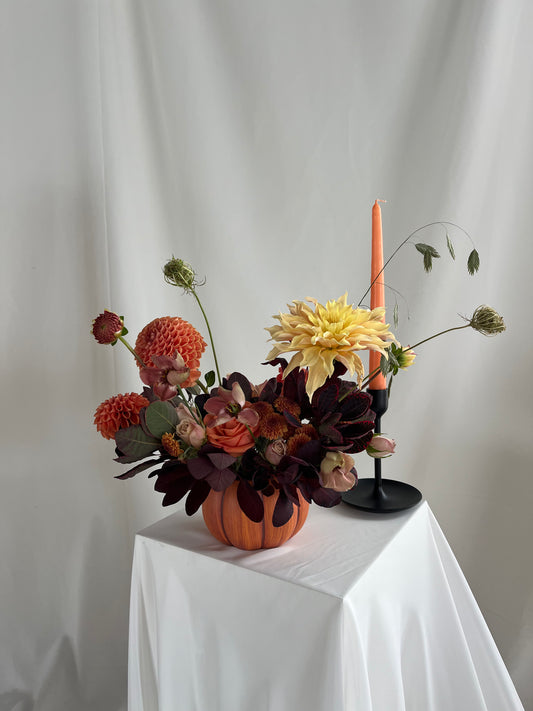 Pumpkin vase arrangement.